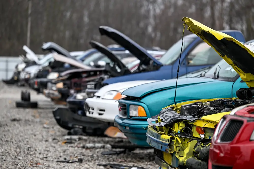 Junk cars at auto parts salvage yard in the city
